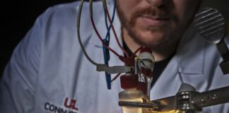 UofL chemistry graduate student Jacob Strain conducts a catalysis experiment at the Conn Center